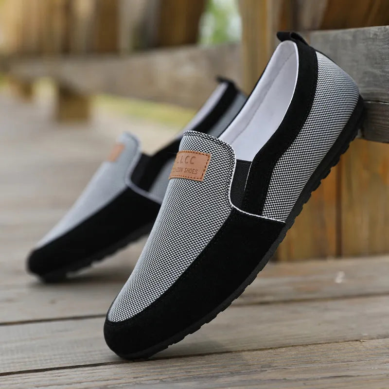 Men's grey and khaki canvas casual board shoes with round toe and stitching detail.