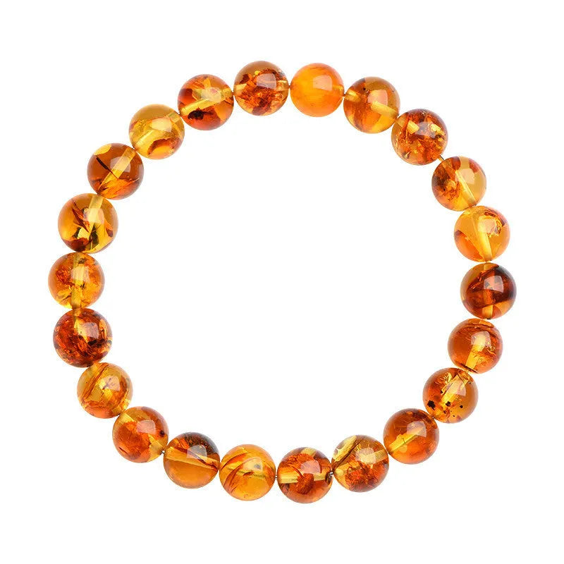 Natural yellow piebald amber bracelet with geometric polished beads showing flower spot patterning