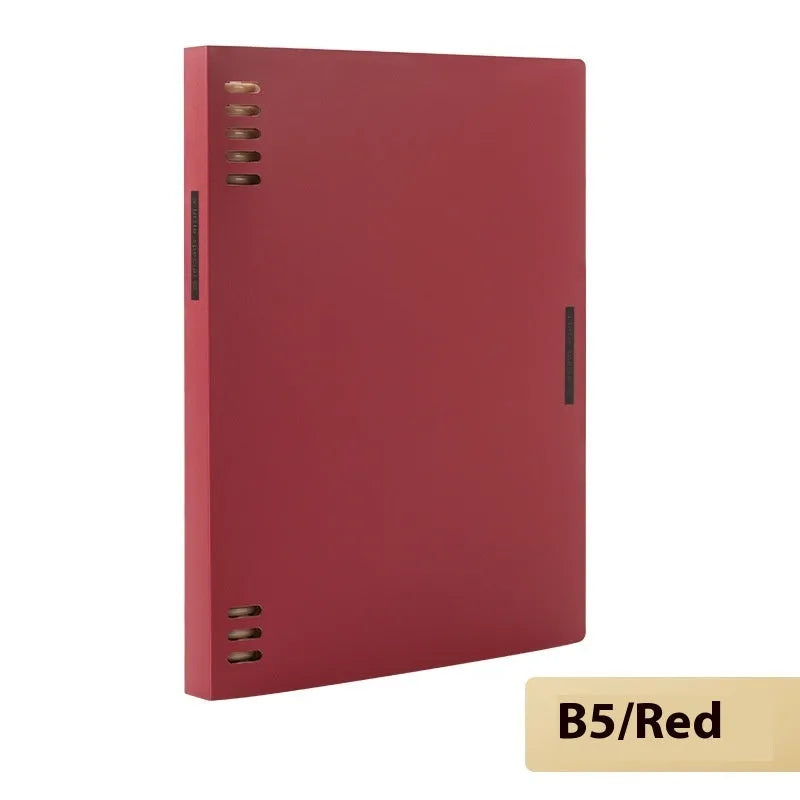 Refillable loose-leaf spiral notebook with PP cover open, showing raw wood pulp paper in grid ruling.