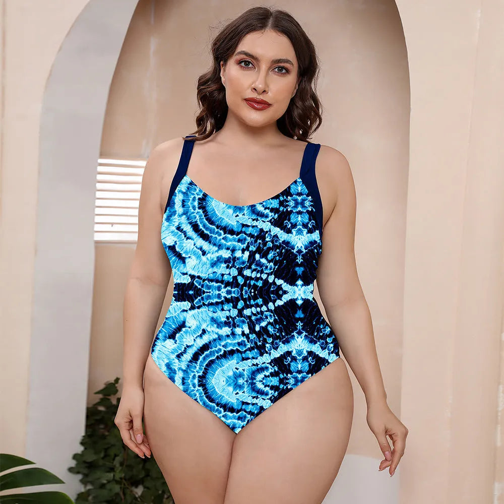 Women's vest style one-piece floral print swimsuit with spaghetti straps on a mannequin.