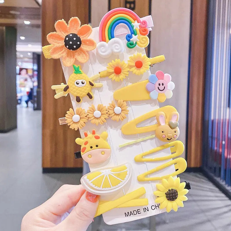 Colourful toddler hair accessories set with 14 pieces including rainbow barrettes, candy fruit pins, and butterfly clips
