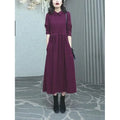 Purplish red plus size women's dress with long skirt and extra long sleeves for urban office wear
