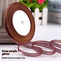 Roll of narrow 0.6cm wide polyester gift wrapping ribbon in assorted colours, showing 22 metre length.