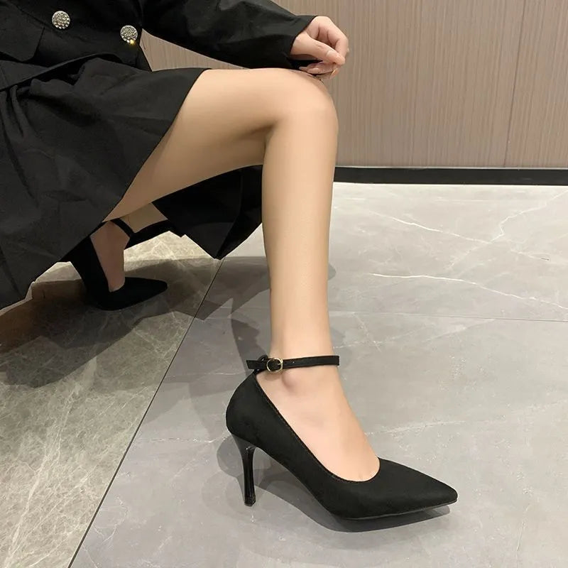 Women's black stiletto heel pump shoe with a buckle detail on the upper