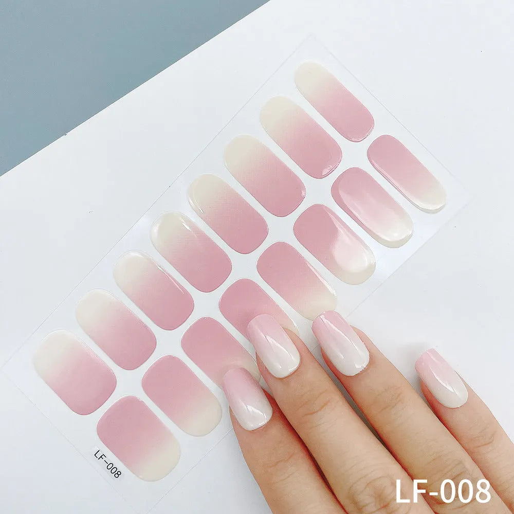 Set of 16 solid colour nail art stickers showing floral, geometric, and pattern designs for manicure application