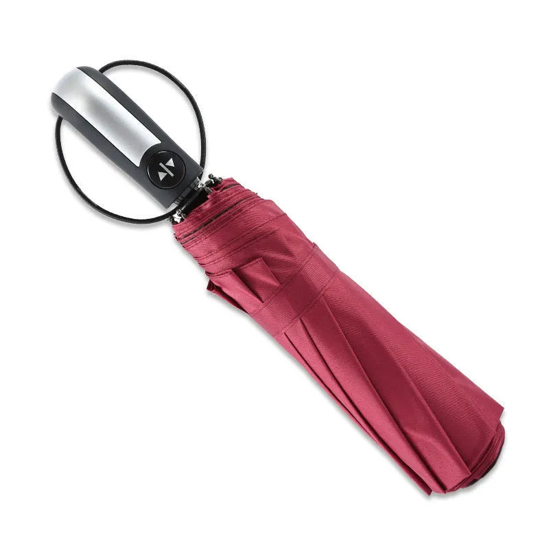 Automatic open triple folding business umbrella in black colour showing steel rib construction