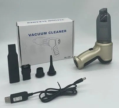 Compact gold or silver wireless car and pet vacuum cleaner with USB charging cable.