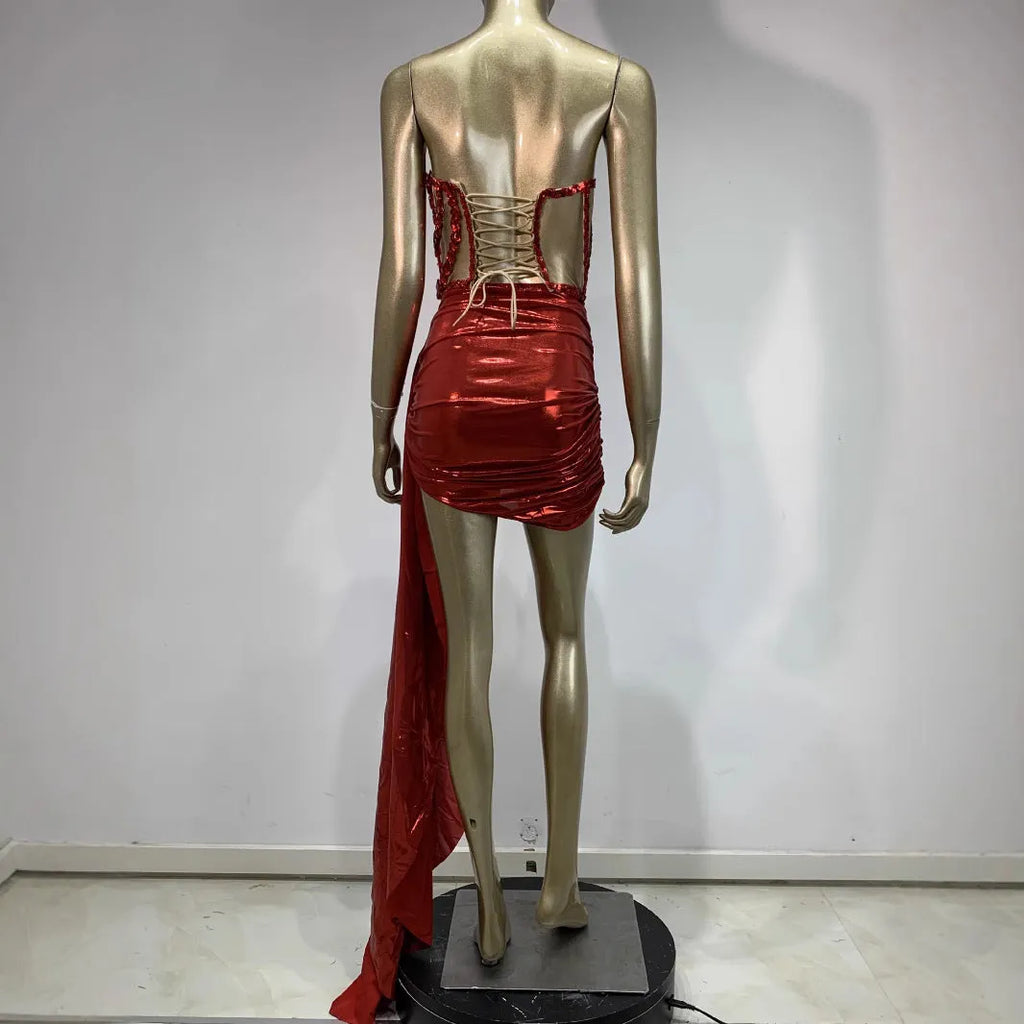Red women's skirt suit with mesh see-through panels, a stage and party costume.