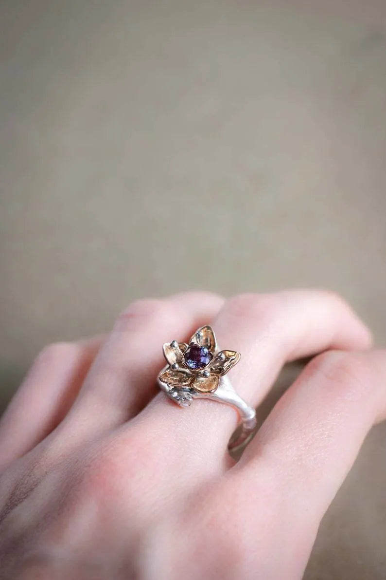 Silver two-tone alloy ring with floral and geometric design for women, showing UK size options.
