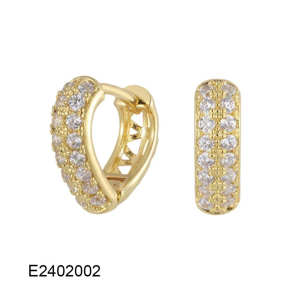 Gold plated brass heart-shaped ear clip earrings with zircon detail on a white background.