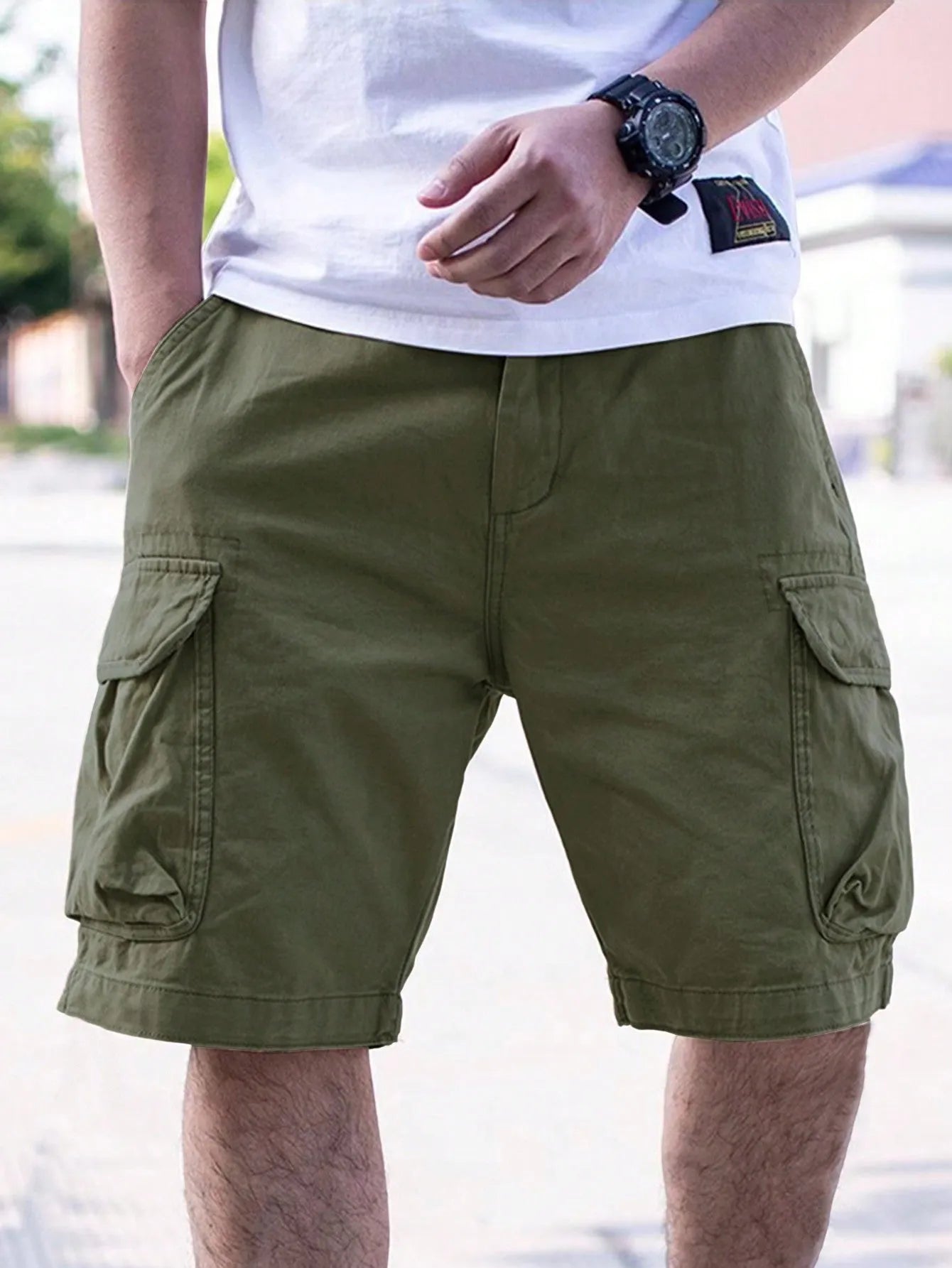 Men's loose-fitting cotton blend shorts in army green with a retro workwear style.