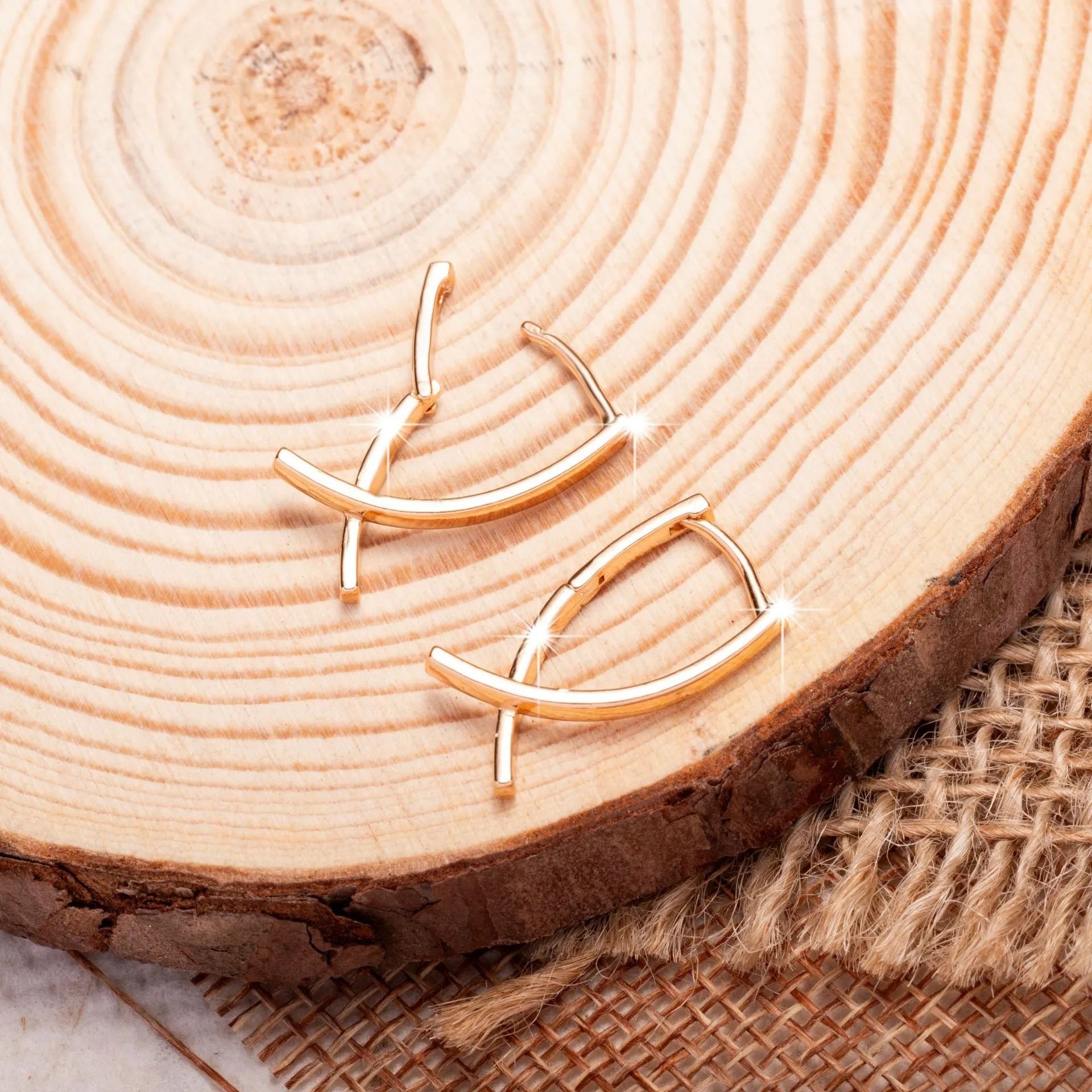 Rose gold cross shaped earrings with polished finish on copper construction