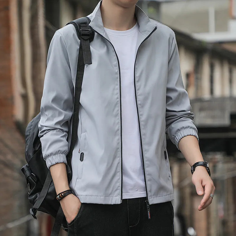 Korean-style men's loose lapel autumn jacket in a casual blue colour with zippered pockets.