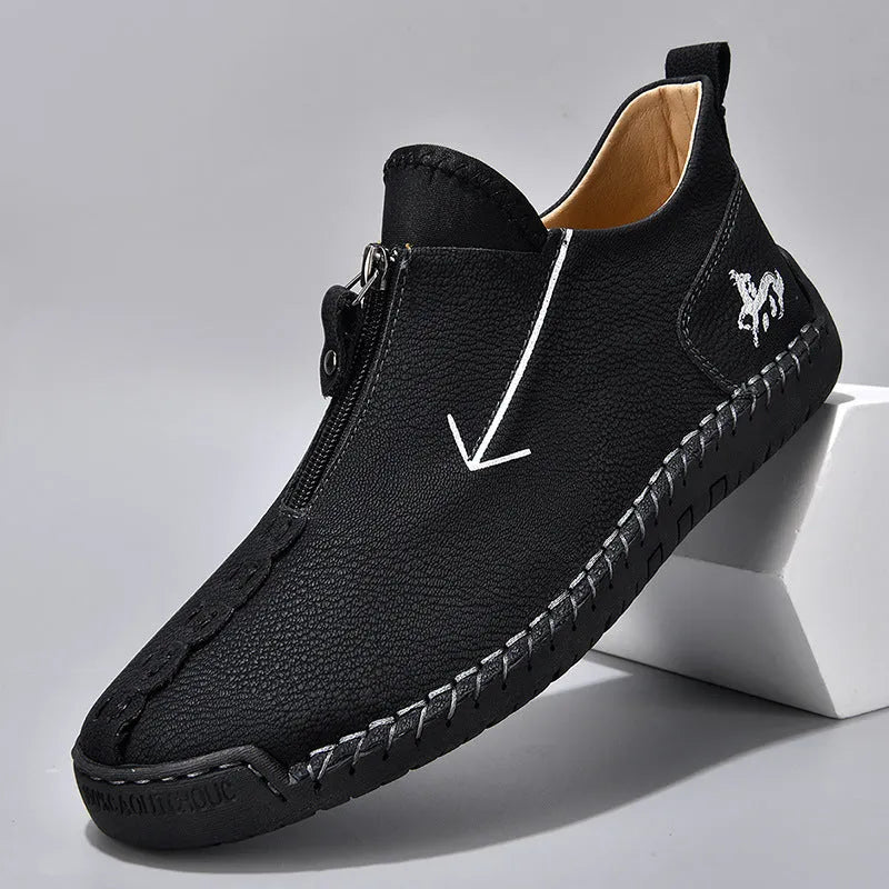 Men's black leather zip-up boots with hand-stitched detailing and round toe