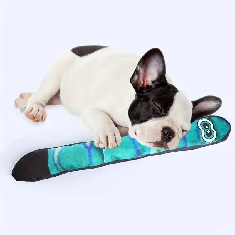 Snake-shaped plush dog squeak toy with rainbow stripe print for chewing and interactive play