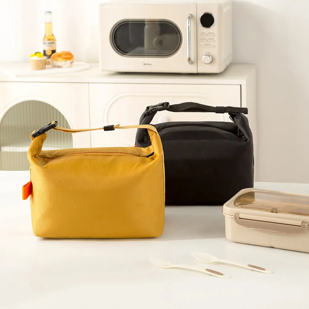 Japanese style insulated lunch bag in Oxford cloth, shown in grey, black, yellow, and army green colours.