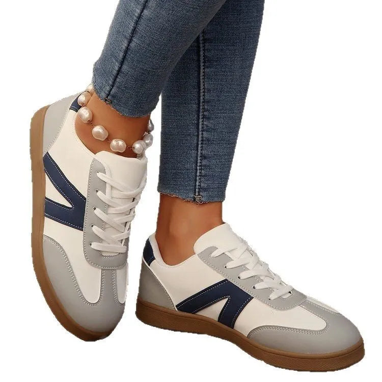 Blue women's low-top lace-up hiking shoes with an artificial PU upper and rubber sole.