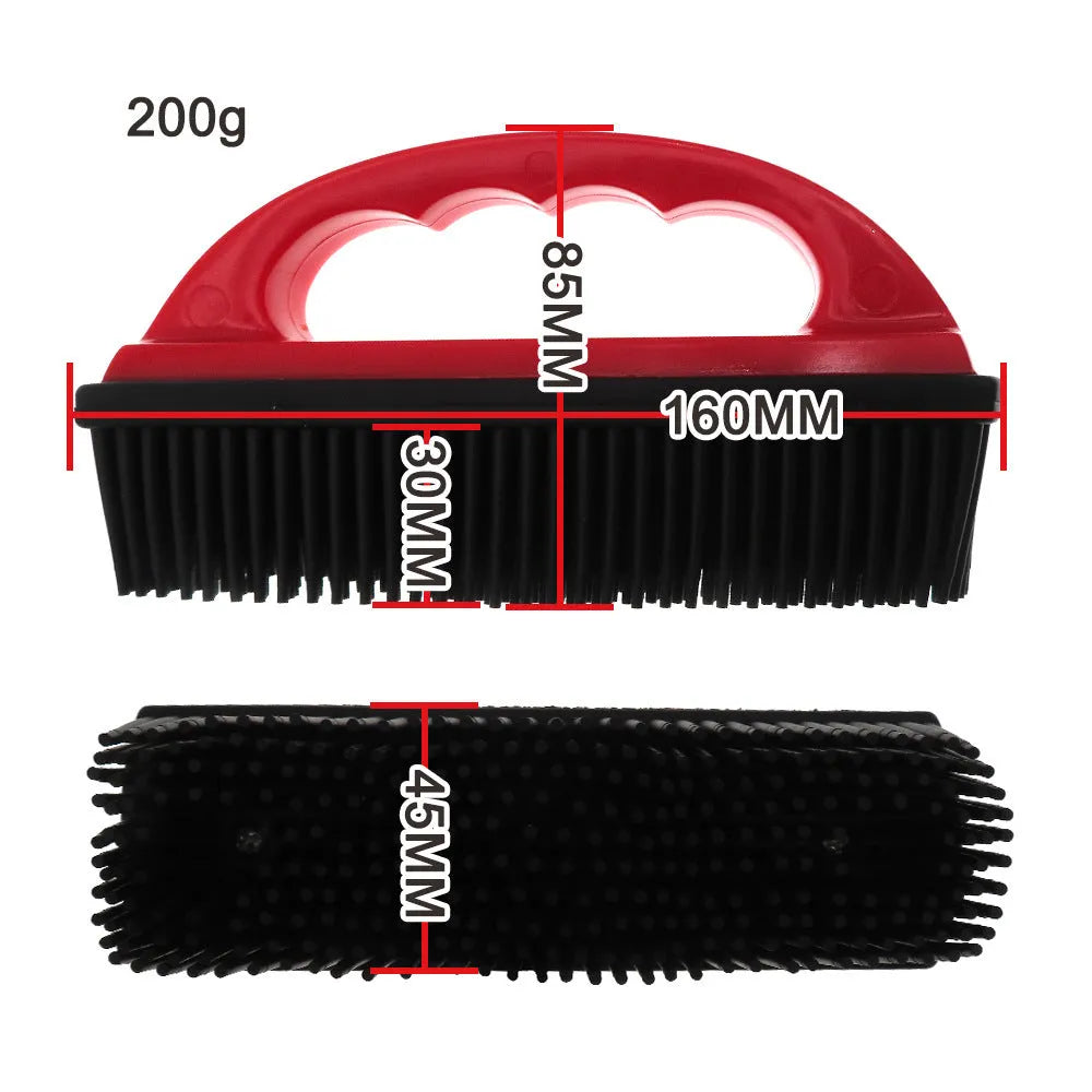 Red pet hair removal and massage brush for grooming and carpet cleaning.