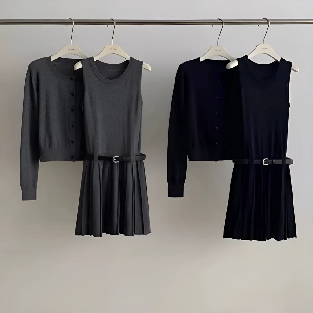 Women's black knitted polyester vest skirt and long sleeve cardigan two-piece set with a belt.