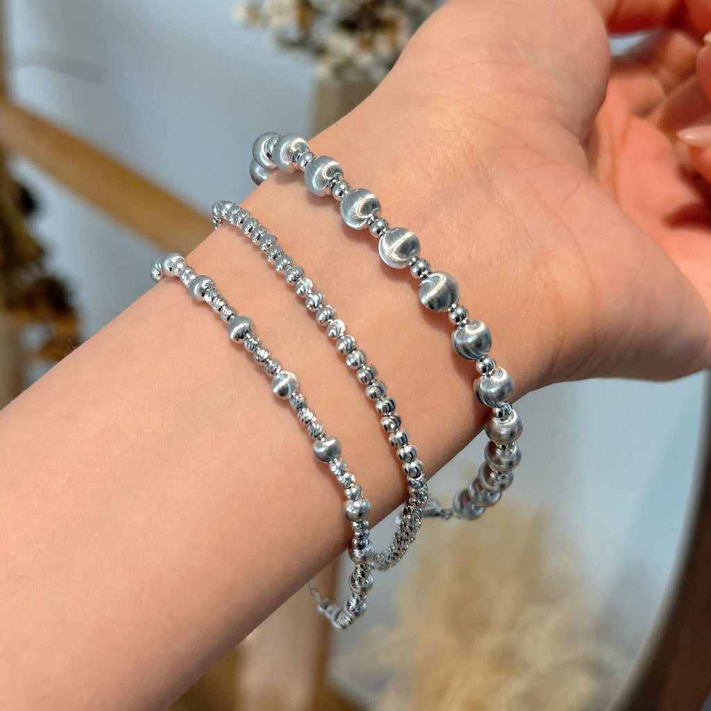 925 sterling silver cat's eye ball bracelet with carved links and brushed finish on white background