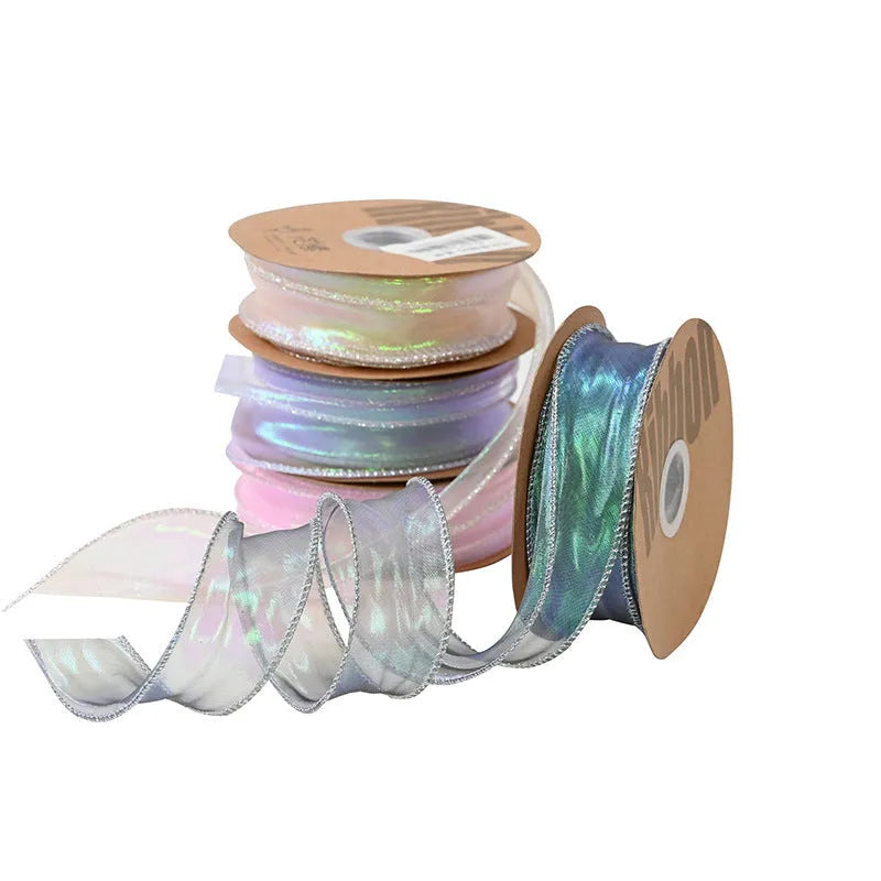 Roll of 4cm wide mesh fishtail yarn floral wave ribbon in multiple illusion colours.