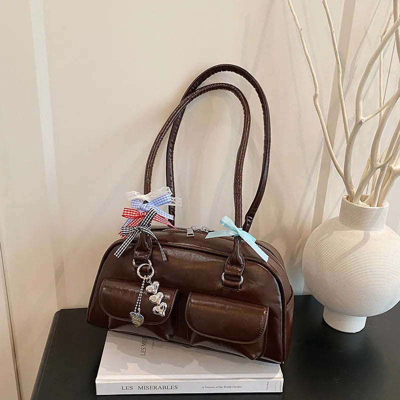Women's retro pillow-shaped PU leather shoulder bag with flap closure and double straps