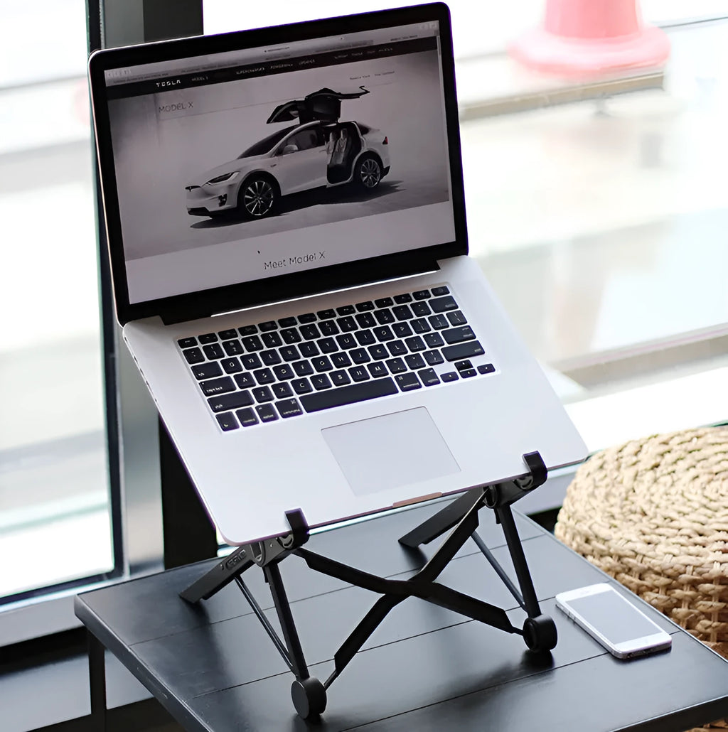 Black folding portable laptop stand made of reinforced nylon, shown folded and unfolded.