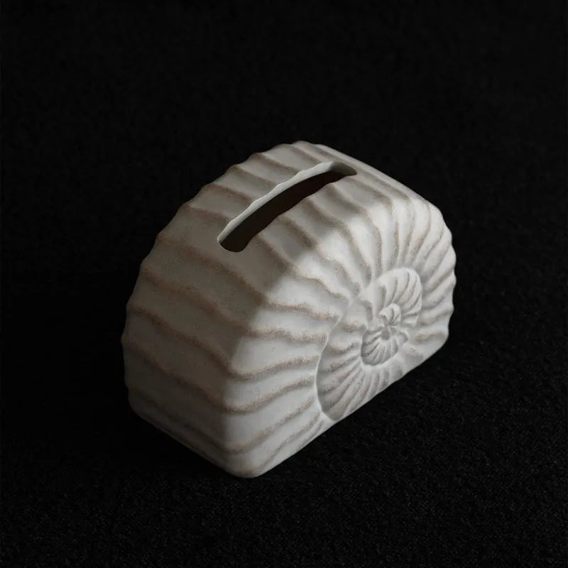 White resin tissue box with conch shell design, modern style, 24cm wide.