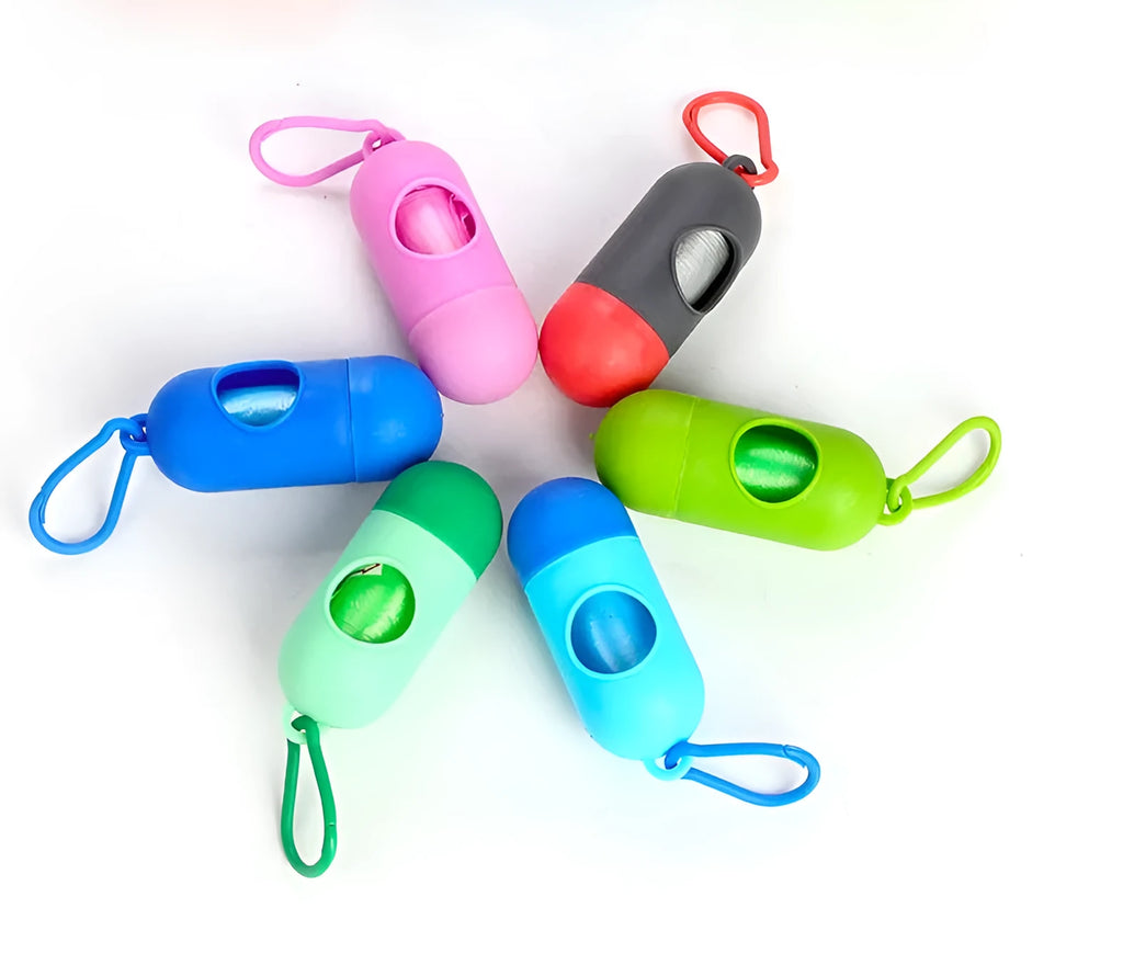 Roll of biodegradable dog poop bags showing multiple colour options including black, blue, green, and pink.