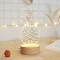 Pineapple-shaped bedside lamp with wood base and acrylic details measuring 24.5x10cm