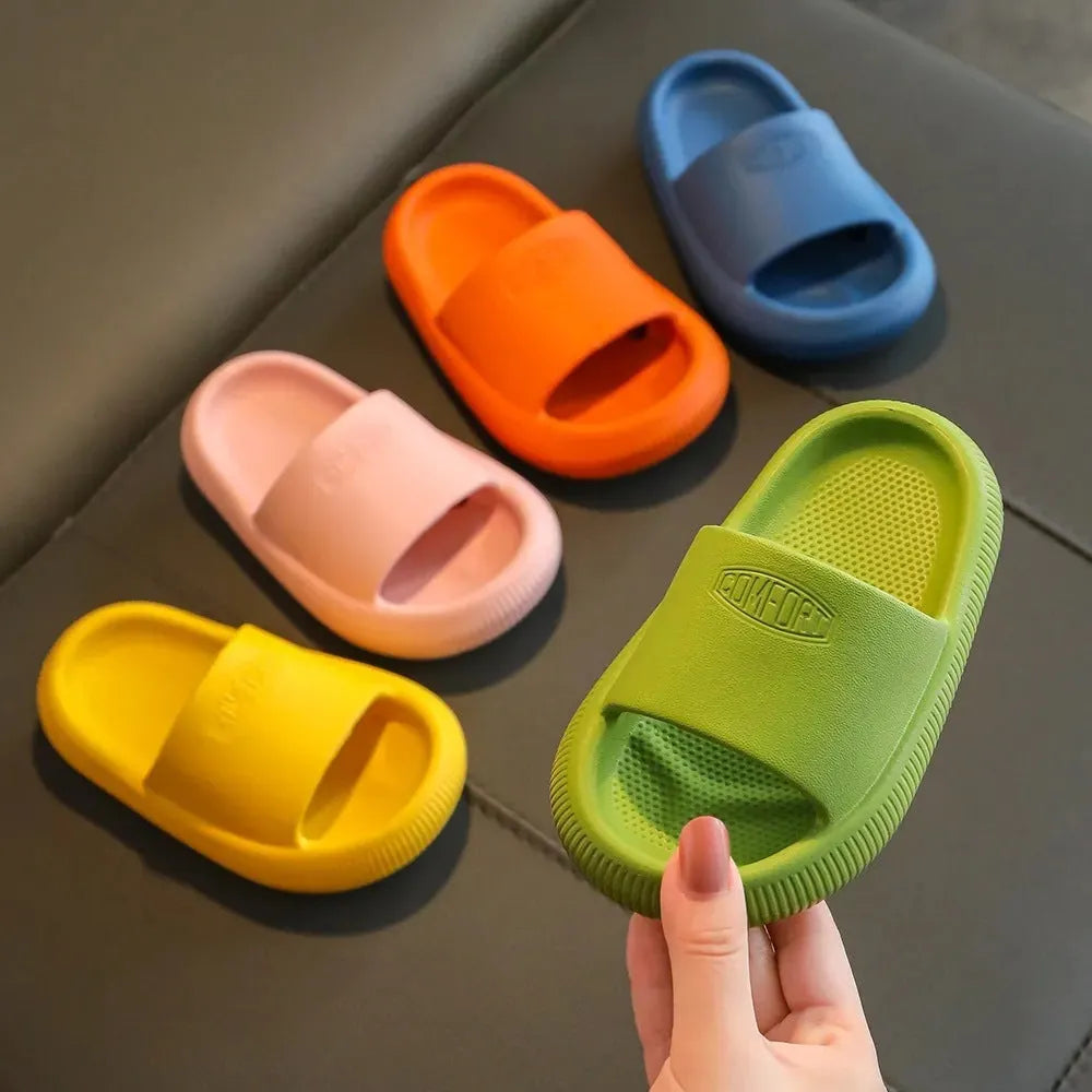 Children's mixed colour EVA slippers with non-slip soles showing size options from 15.5cm to 21.5cm