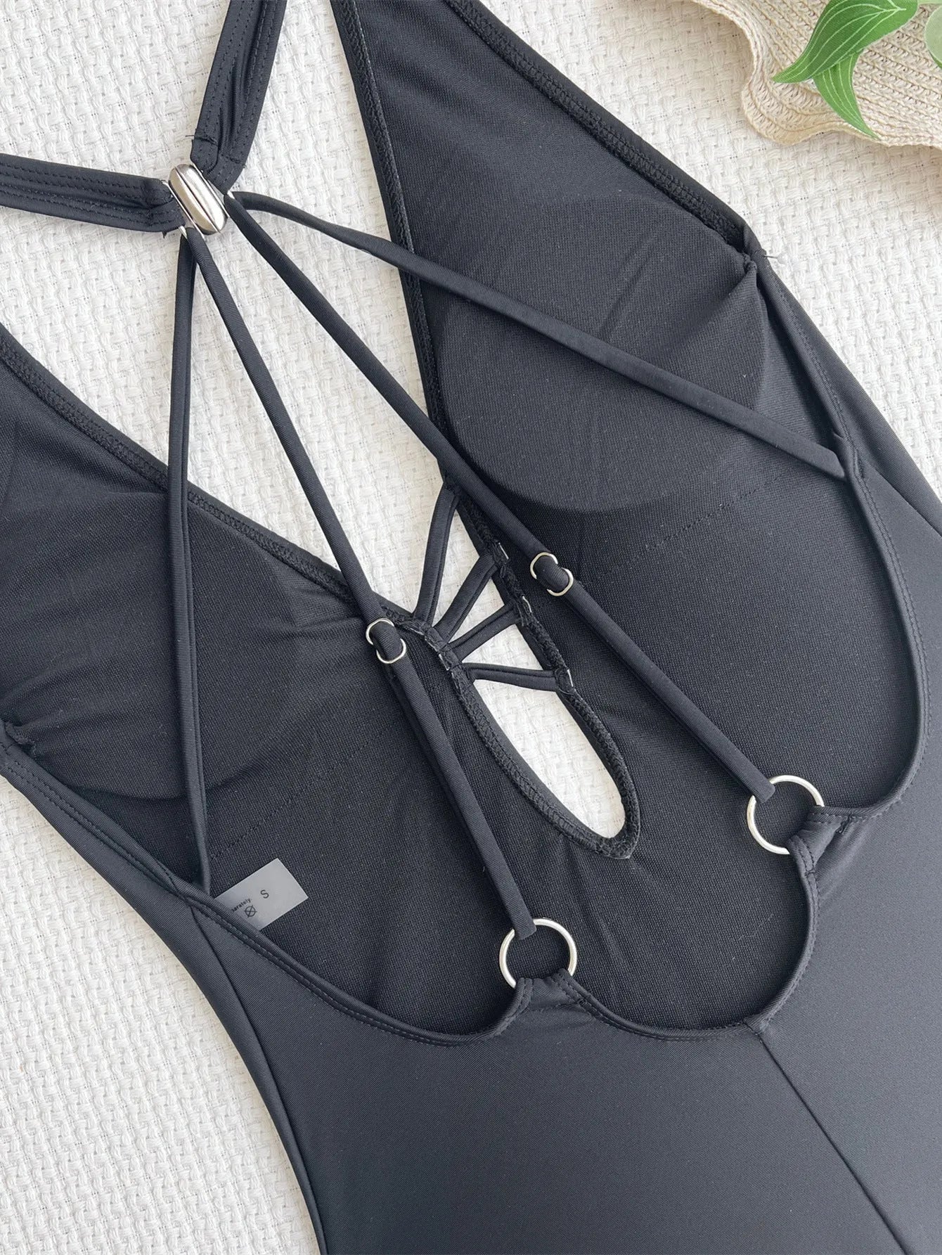Black solid colour ladies bikini swimsuit made from nylon fabric for swimming and wading