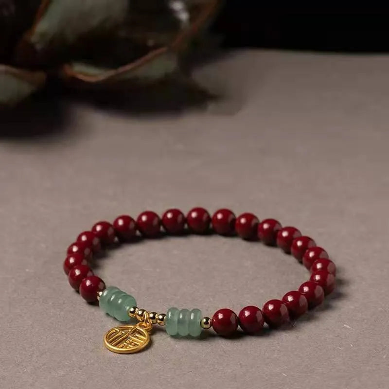 Gold cinnabar bracelet with wave design and copper beads in traditional Chinese style