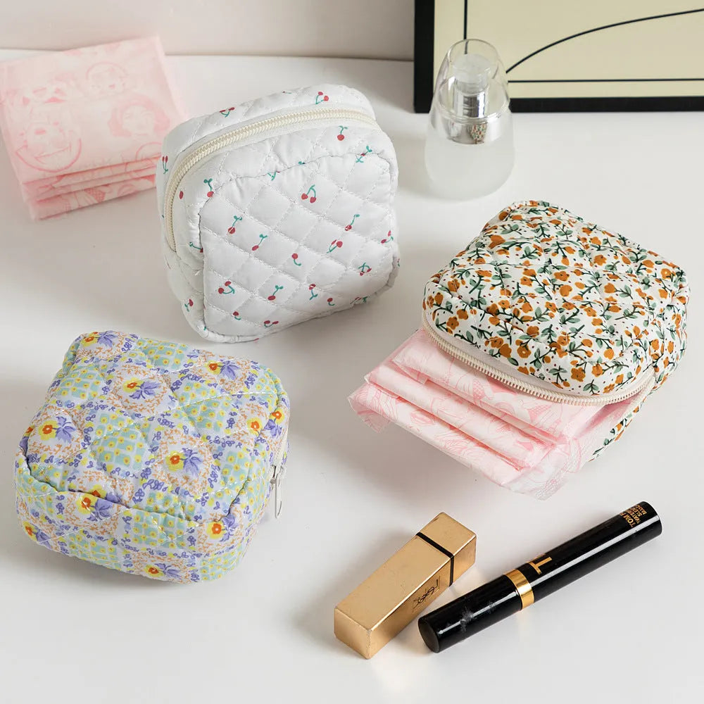 Breathable polyester key storage bag showing multiple floral and cherry pattern options including white background designs