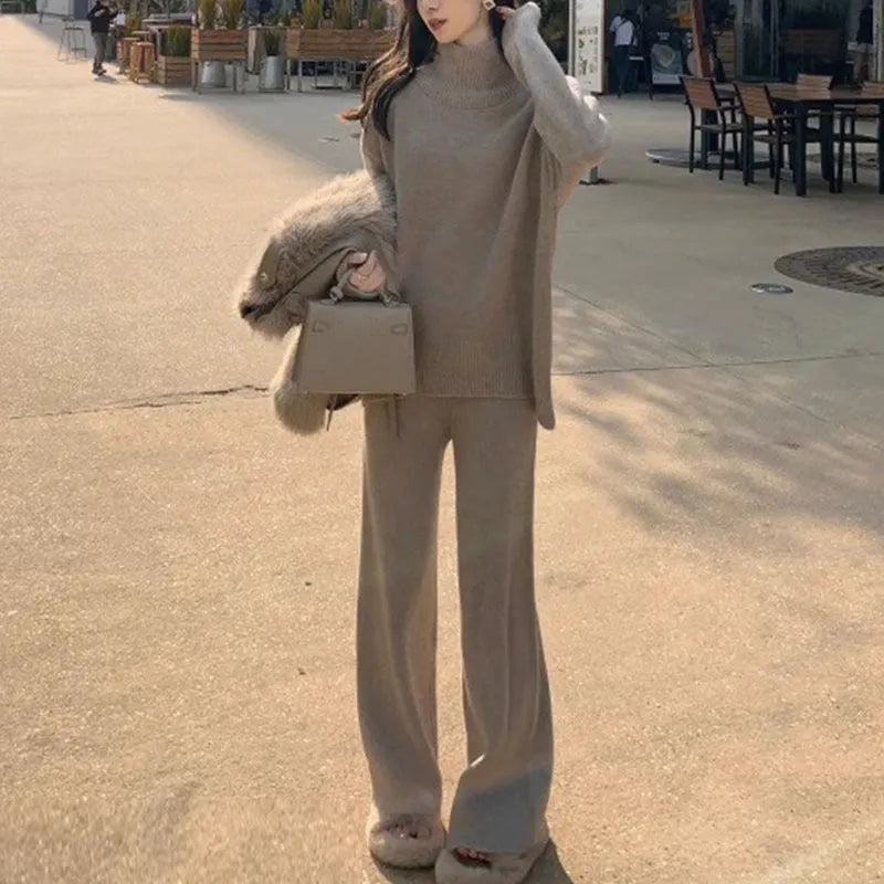 Women's casual two-piece set featuring a long sleeve sweater and wide leg trousers in a solid colour.