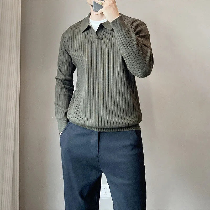 Man wearing a loose grey rabbit fur blend knitted pullover sweater, casual autumn style.