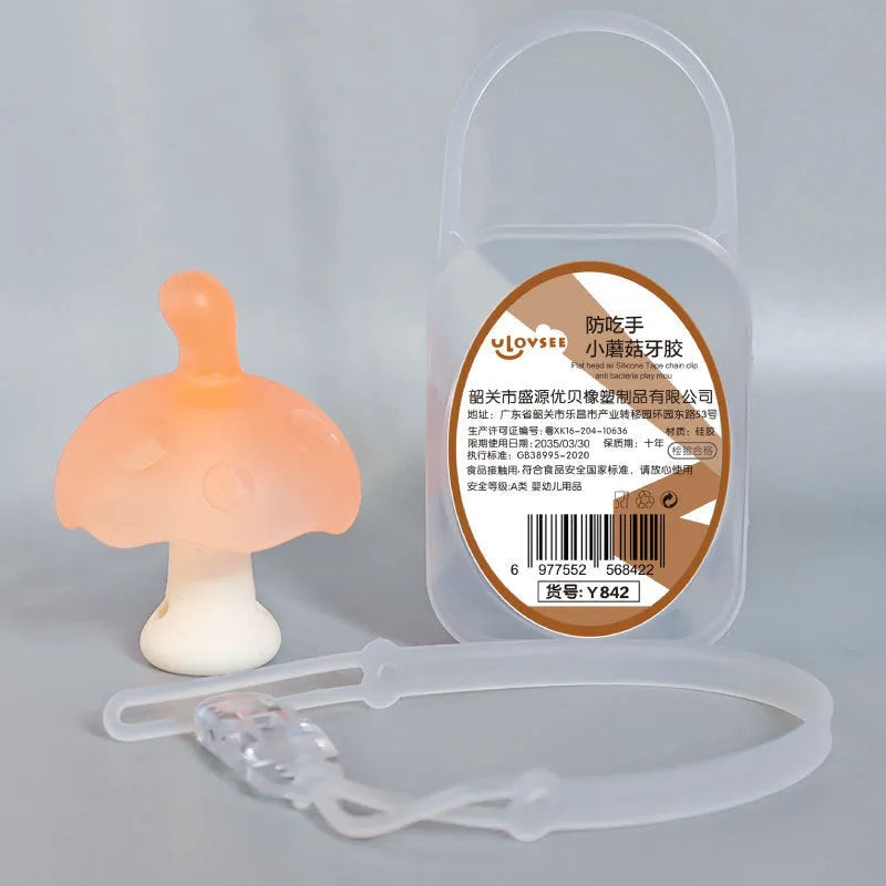 Small mushroom-shaped silicone chew gum with transparent chain attachment in pink colour