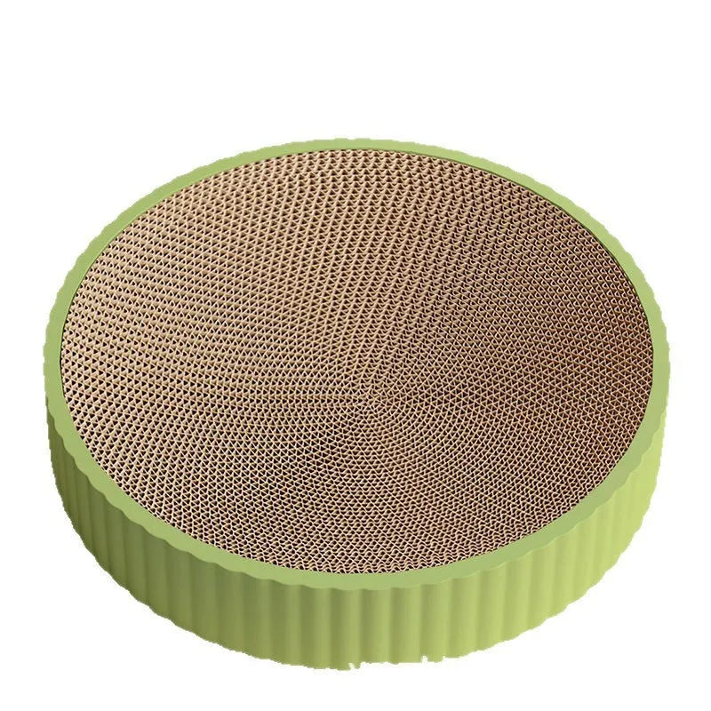 Green round cat scratching board with corrugated paper surface measuring 55 cm diameter