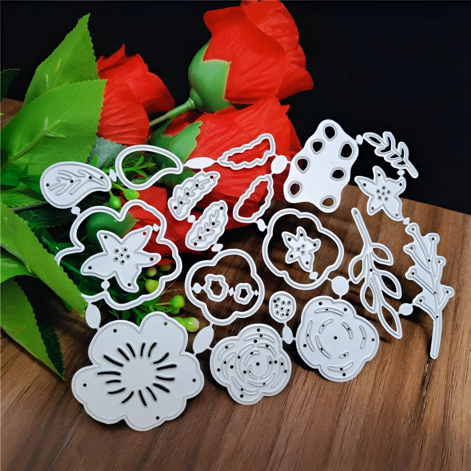 Silver carbon steel flower-shaped cutting mould measuring 14.3 by 9.9 centimetres