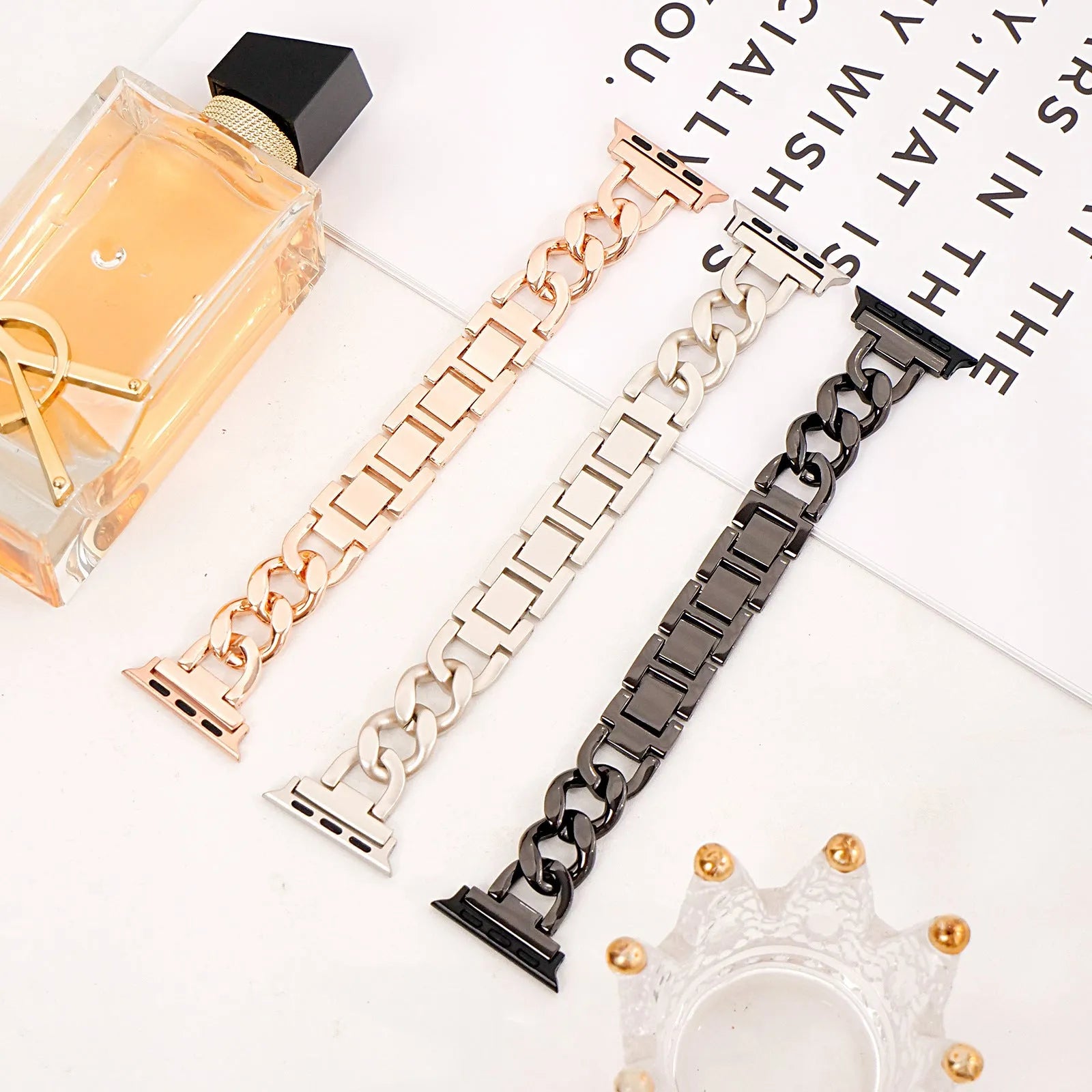 Metal denim chain replacement strap for Apple Watch in silver, black, gold, rose gold, and Starlight colours.