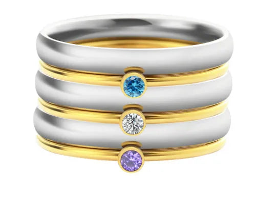 Geometric titanium steel ring featuring an engraved December birthstone design on a finger.