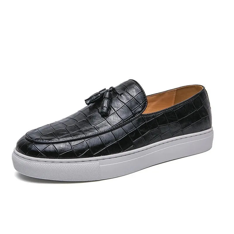 Men's black faux leather sneakers with a tassel detail on the upper, shown on a white background.