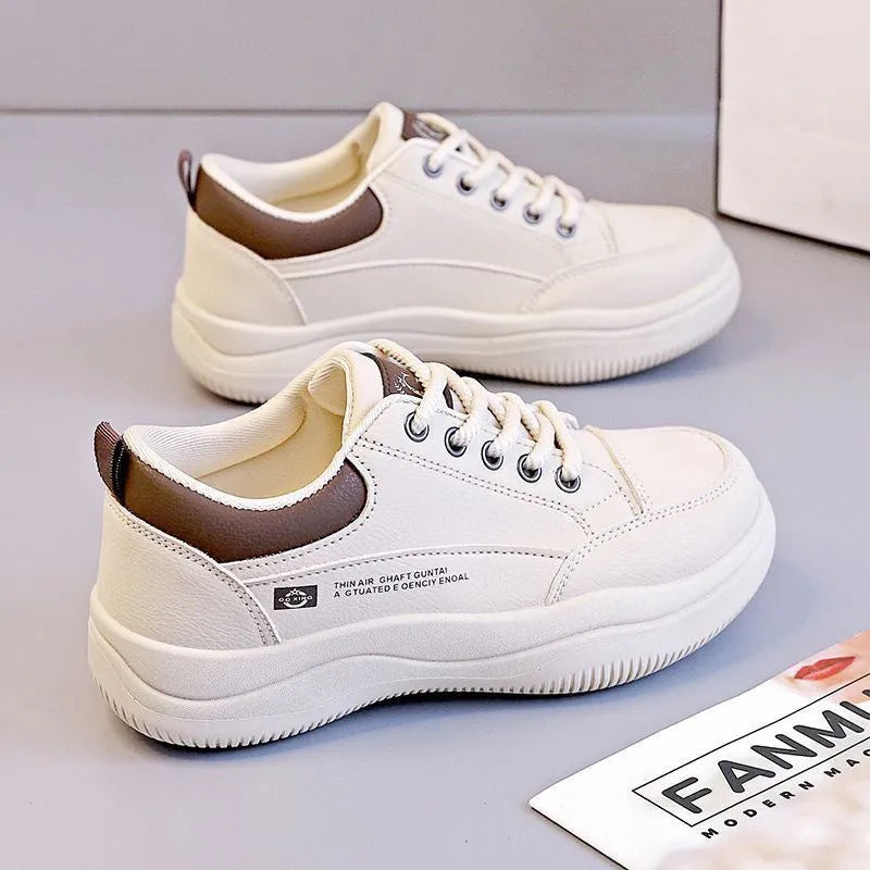 Women's white Korean-style lace-up shoes with cross straps and a mid heel on a rubber sole.