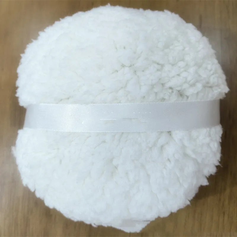 Oversized plush makeup powder puff in white, shown with dimensions 150mm by 75mm