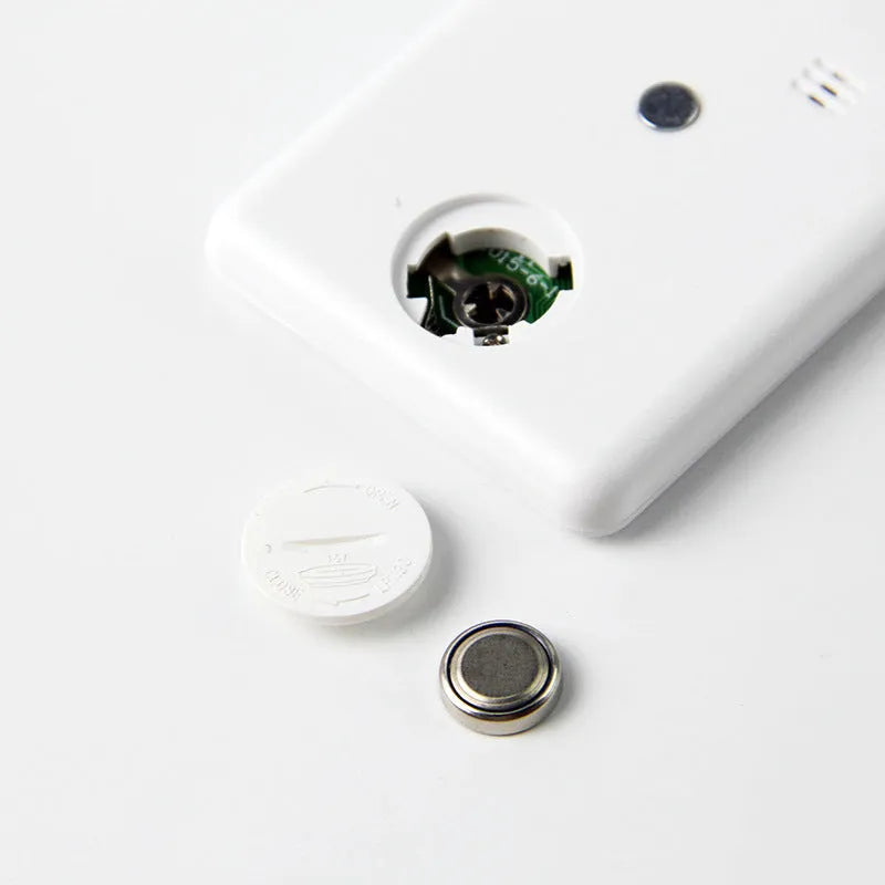 Black and white kitchen timer with magnetic back showing count-up and countdown display