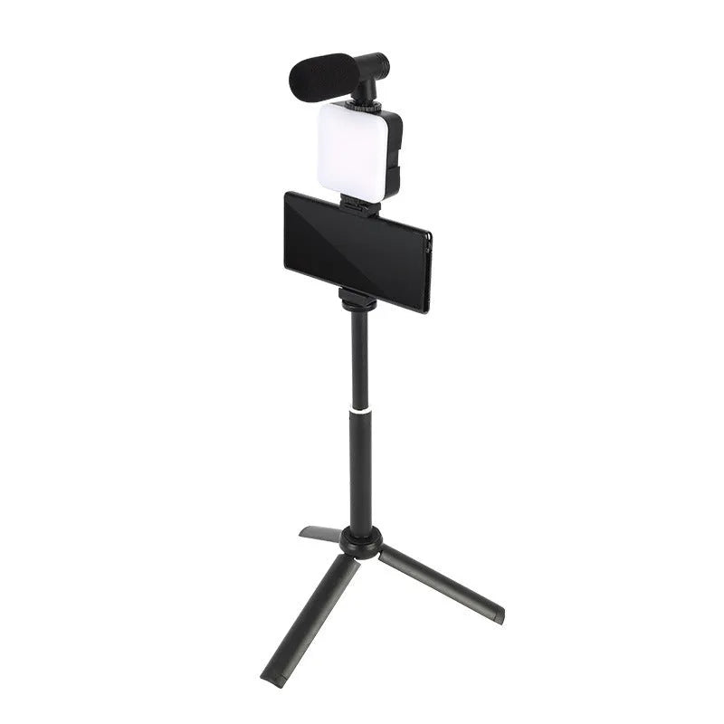 LED mini square universal camera flash on a pocket tripod, showing compact size and rotatable flash head.