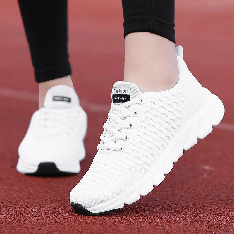 Women's running shoes with fly weaving upper in black, pink, or white colours.