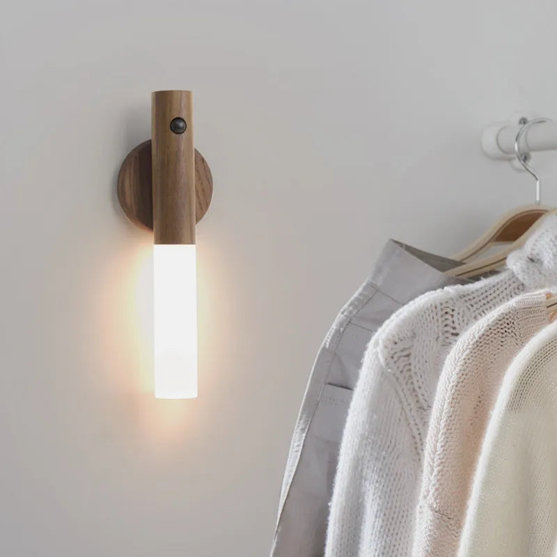 Smart sensor LED desk lamp with solid wood base and clear acrylic shade on a wooden table.