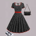 Multicolour polka dot pleated dress with square collar, short sleeves, and a zipper.