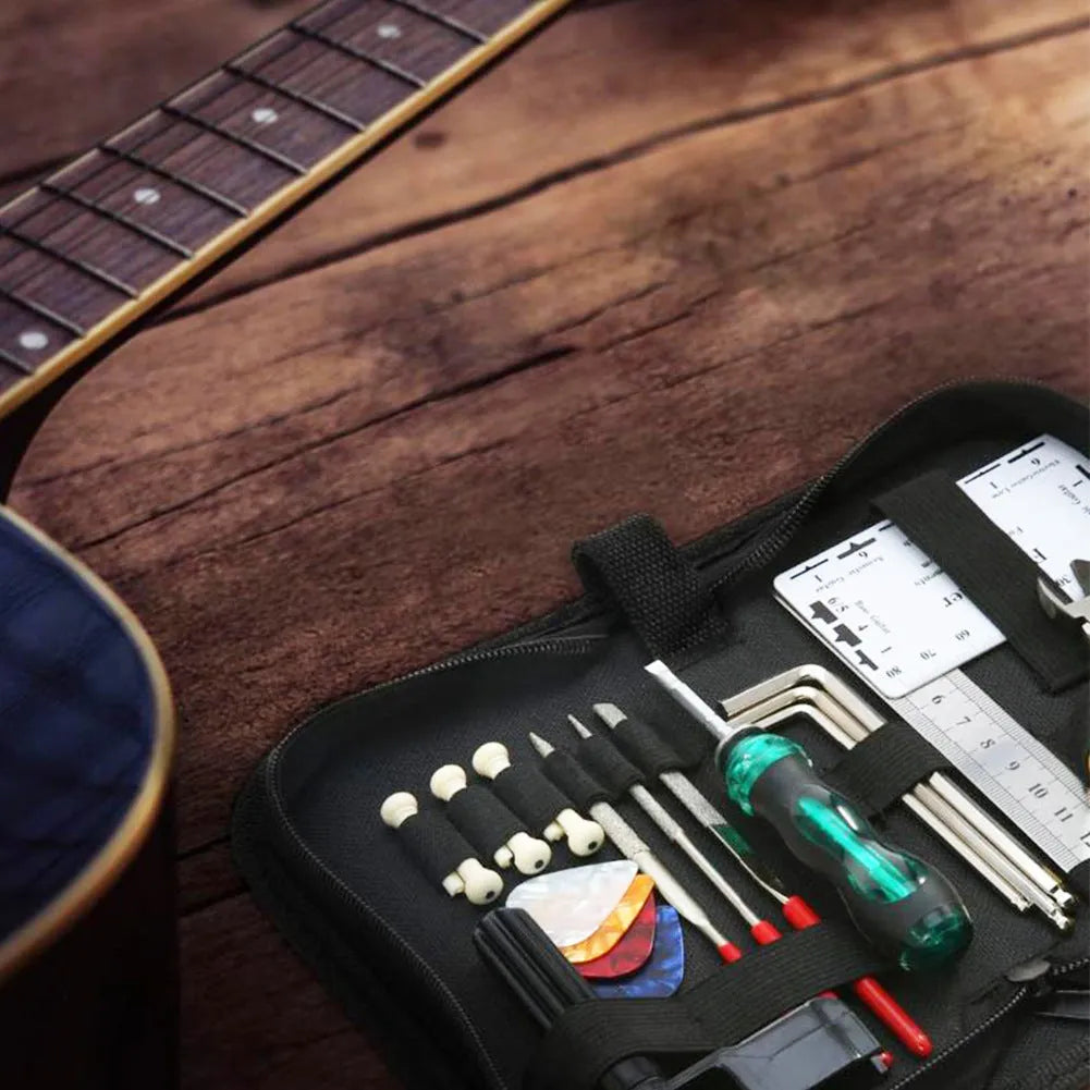 Black plastic and metal guitar repair tool kit case measuring 200mm by 100mm.